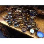 A collection of Victorian copper lustre - jugs, some pairs, bowls, tankards, some embossed, a