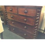 A Victorian mahogany chest of drawers, the rectangular top of re-entrant outline above two short and