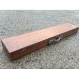 A Victorian mahogany gun case of dovetailed construction, having leather handle and brass hinges &