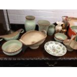 A six pieces of Denby stoneware with trailing slip decoration on pale green ground; two Lovatts