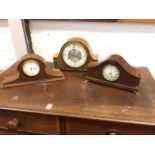 An Edwardian mahogany mantle clock inlaid with chequered stringing having enamelled dial under