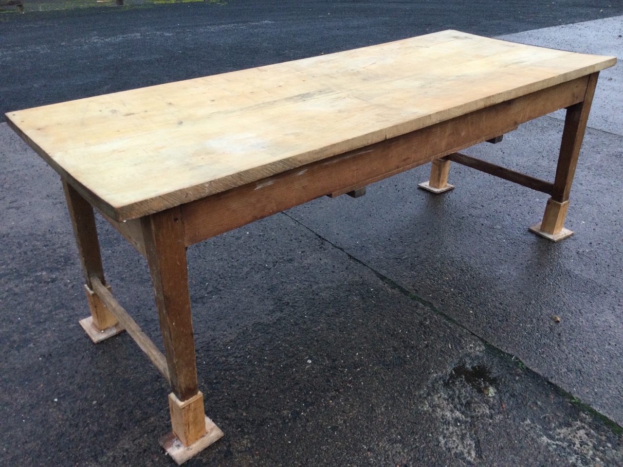 A Victorian kitchen table, the rectangular two plank chestnut top on dowel jointed pine base with