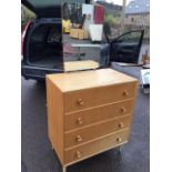 A 60s oak Meredew dressing table, with rectangular rounded mirror above four long drawers mounted