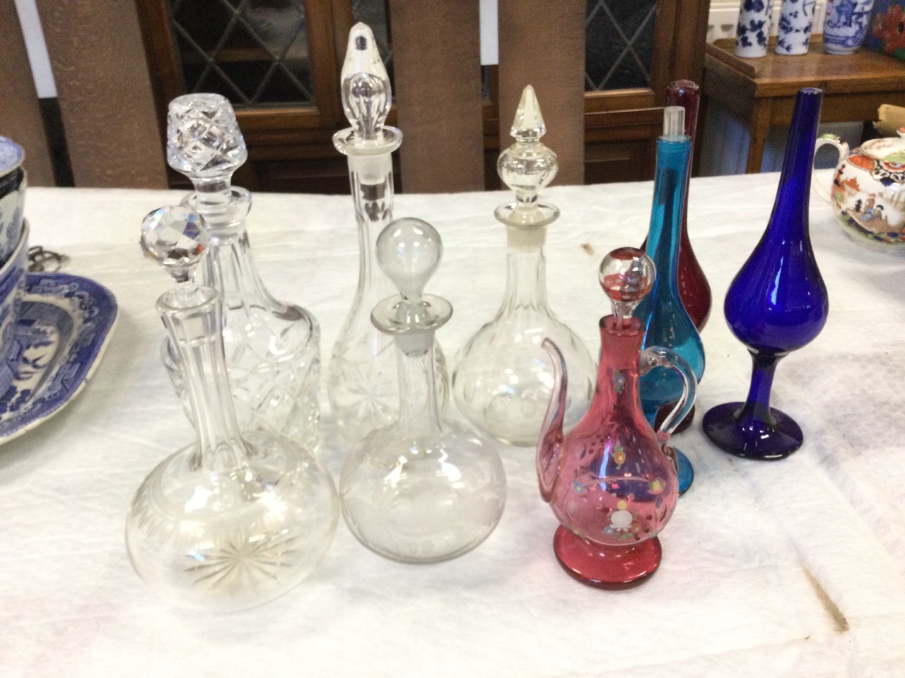 Five miscellaneous cut glass decanters & stoppers - faceted, acorn & oakleaf engraved, mallet shape,