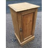 A Victorian pine pot cupboard with later alterations, the panelled door with egg & dart mouldings,