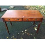 A nineteenth century mahogany side table, the rectangular moulded top above two frieze drawers