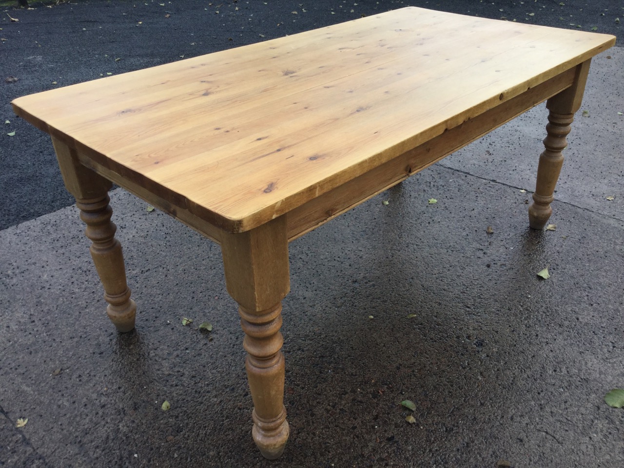 A pine kitchen table, the rectangular thick plank top on turned legs. (70.5in x 35.5in x 30.75in) - Image 3 of 3