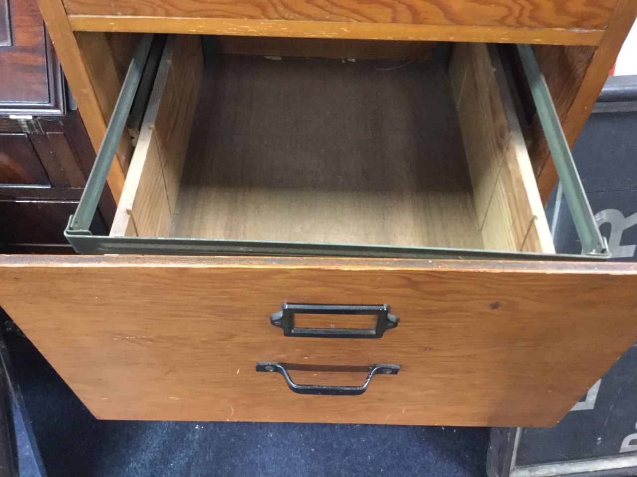 A large wood filing cabinet, the four drawers mounted with metal handles and label holders. (20in - Image 3 of 3