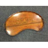 A nineteenth century kidney shaped mahogany tray, the scalloped rim mounted with brass handles,