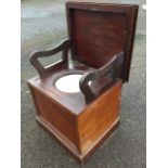 A Victorian mahogany commode box, with moulded top enclosing a fitted interior with shaped hinged