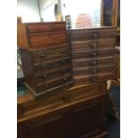 A small Edwardian oak collectors cabinet with four knobbed drawers above a plinth; a three-drawer