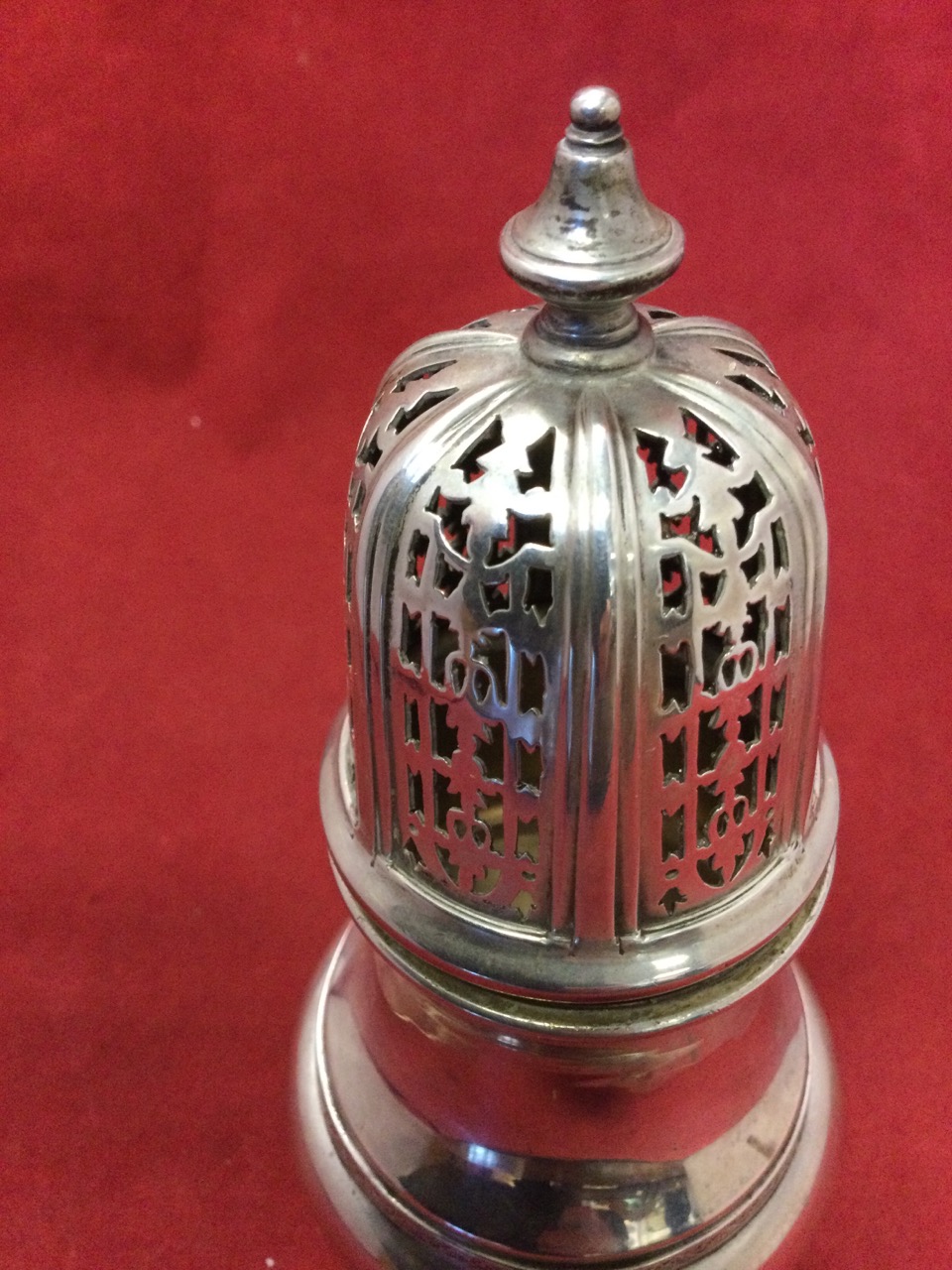 A Georgian style hallmarked silver caster, the pierced hexagonal domed cover with turned finial - Image 2 of 3