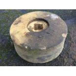 A circular sandstone grinding wheel. (13.25in x 6in)