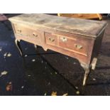 A knackered Georgian oak dresser, the rectangular moulded top above two crossbanded drawers