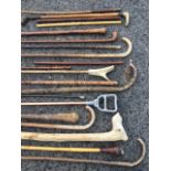 A miscellaneous collection of sticks - hazel, leather swagger type, horn handled, riding crops, a