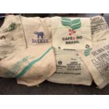 A collection of hessian & string coffee bean import sacks - South American, Vietnam, Brazil,