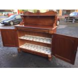 A Victorian mahogany chiffonier, the scrolled back with rectangular moulded shelf on pierced