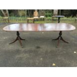 A Georgian style mahogany twin pedestal dining table