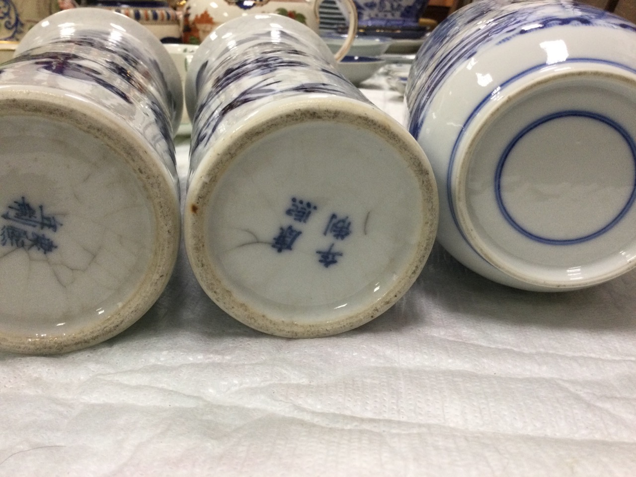 A pair of Japanese tubular vases with flared rims painted with birds, butterflies and prunus blossom - Image 3 of 3