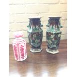 A pair of Chinese hexagonal famile verte vases decorated with floral scalloped lily panels on