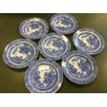A set of seven nineteenth century blue & white pearlware plates decorated with chinoiserie landscape