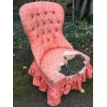 A Victorian style spoonback button upholstered chair, the sprung seat raised on carved stub cabriole
