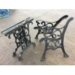 A pair of cast iron bench ends of scrolled design, with a marching pair of table supports, the