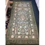 A handsewn wallhanging with central scalloped moorish floral panel in rectangular field with