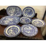 A nineteenth century wild rose pattern plate; two Victorian willow pattern blue & white ashets;