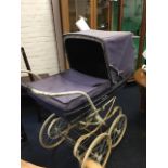 A large 1950s Silver Cross pram, with canvas concertina hood on lined padded carriage, the sprung