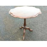 A rectangular scalloped top mahogany occasional table raised on baluster turned column with tripod