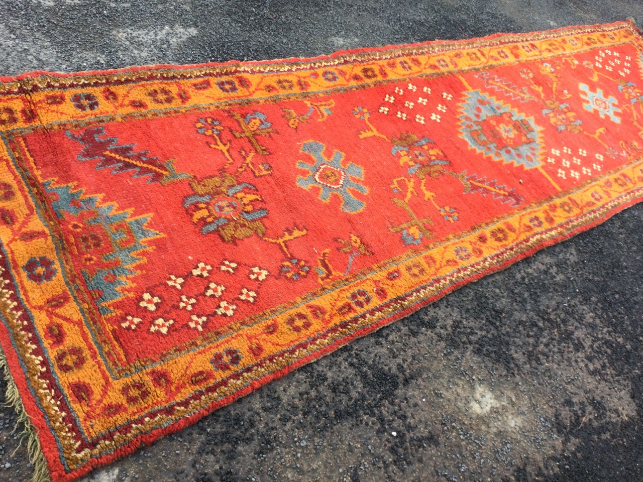 A Turkey runner, the red field woven with serrated, star & floral motifs framed by orange border - Image 2 of 3