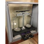 A cased set of Griffin & George laboratory scales, the balance with circular chrome trays on