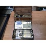 Late 19th century microscope in case together with medical test set in metal case