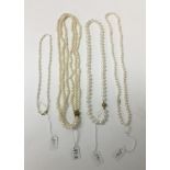 Four cultured pearl and freshwater cultured pearl necklaces, one with 18ct gold clasp, the others