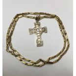 Yellow metal and gem-set cross pendant on chain, stamped NG10K