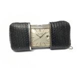 1950s-1960s Movado Ermetoscope stainless steel and black leather purse watch with silvered dial