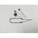 Group of four gold stick pins to include a novelty 9ct gold and enamel flying ladybird stickpin,