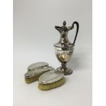 Three silver backed brushes and a 19th Old Sheffield Plate hot water pot