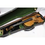 Old violin with two bows in case