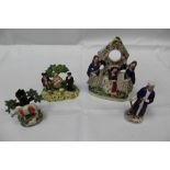 Group of four Staffordshire / Pearlware figures including a watch stand and Shylock (4)