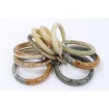 Ten jade/green hard stone polished bangles