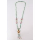 Green hardstone bead necklace decorated with rose quartz beads and gilt floral enamelled large bead