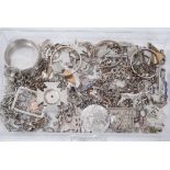 Collection of silver and white metal jewellery coin mounts, chains, watch case and other items