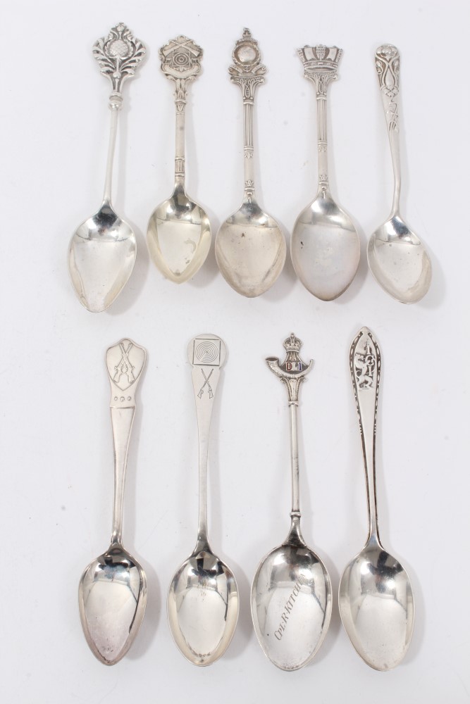 Nine silver military related and other teaspoons