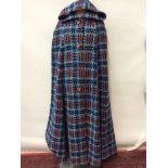 Ladies 1950s full length hooded cape in woven wool tapestry, with wooden buttons.