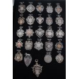 Collection of twenty five Victorian and later silver fobs