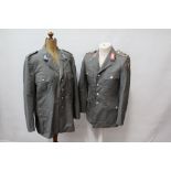 Two post Second World War German military jackets, together with other uniform