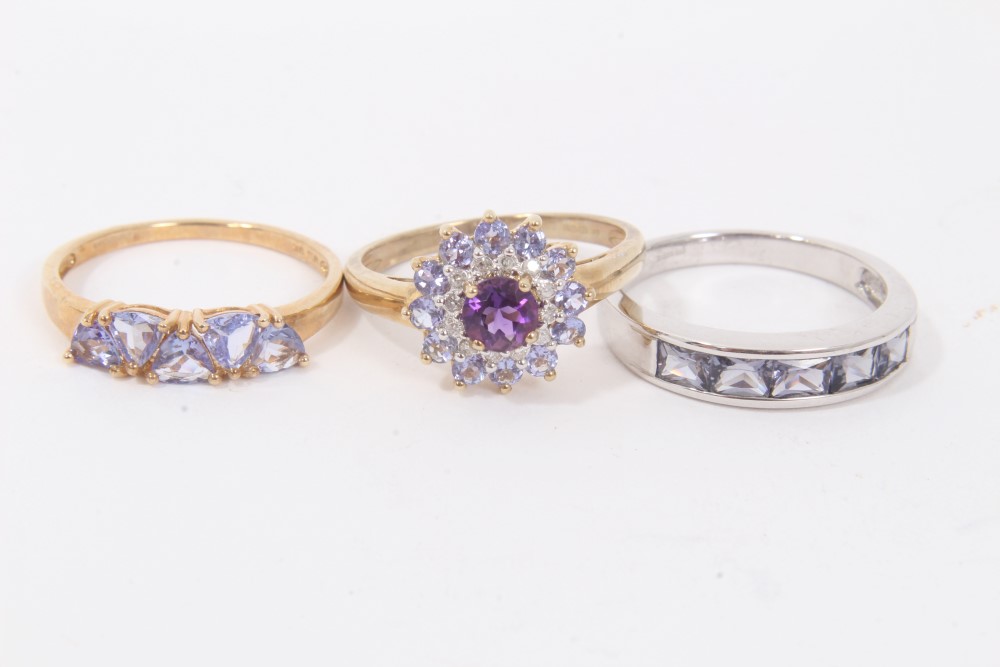 Three 9ct gold purple stone dress rings