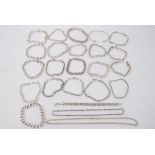 Large group of silver and white metal bracelets and necklaces